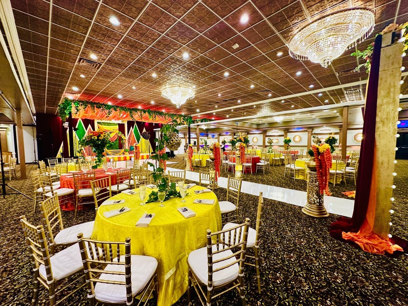 The room dressed in yellow and gold for a celebration