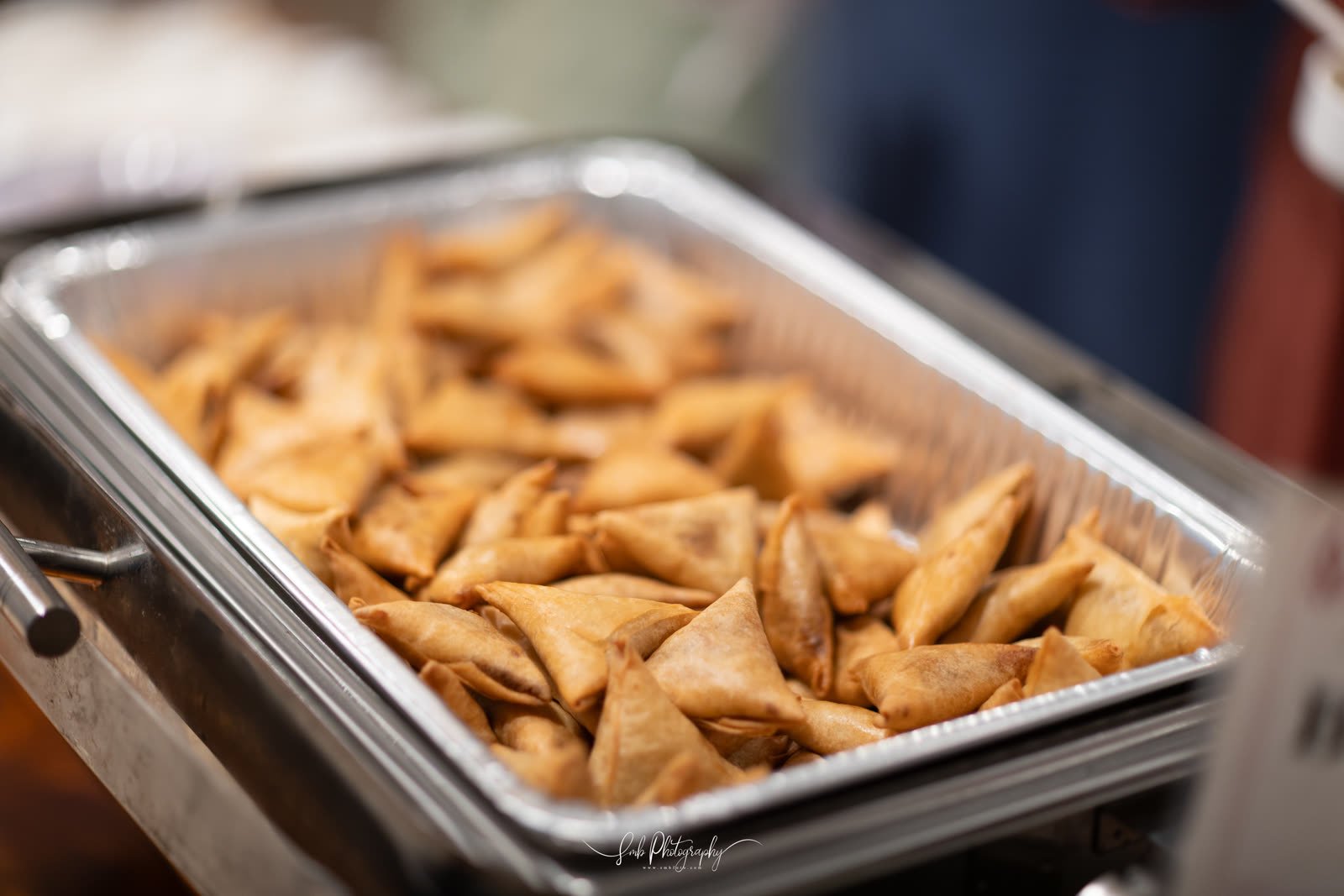 Samosas plated in quantity