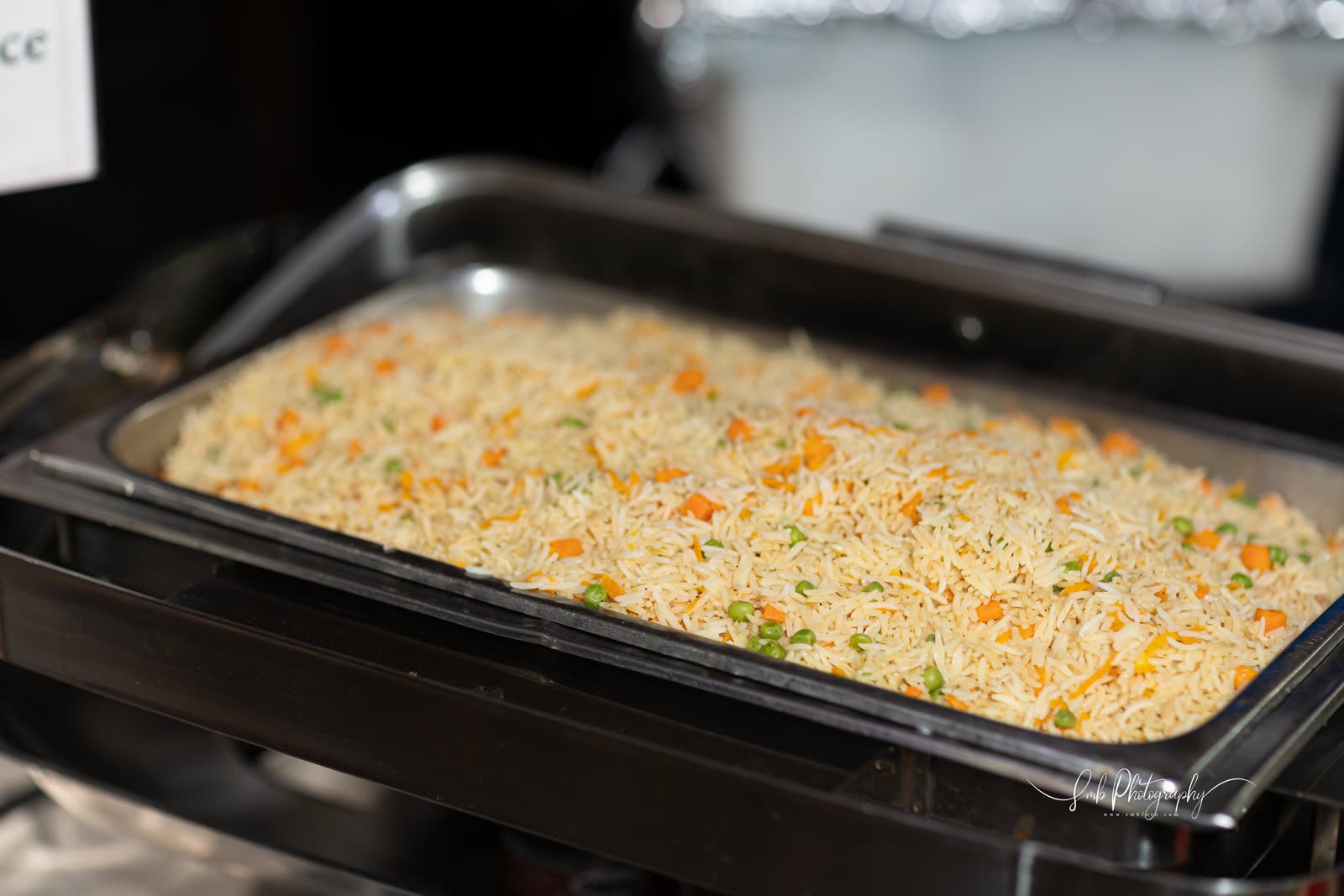 A full tray of rice on the buffet line