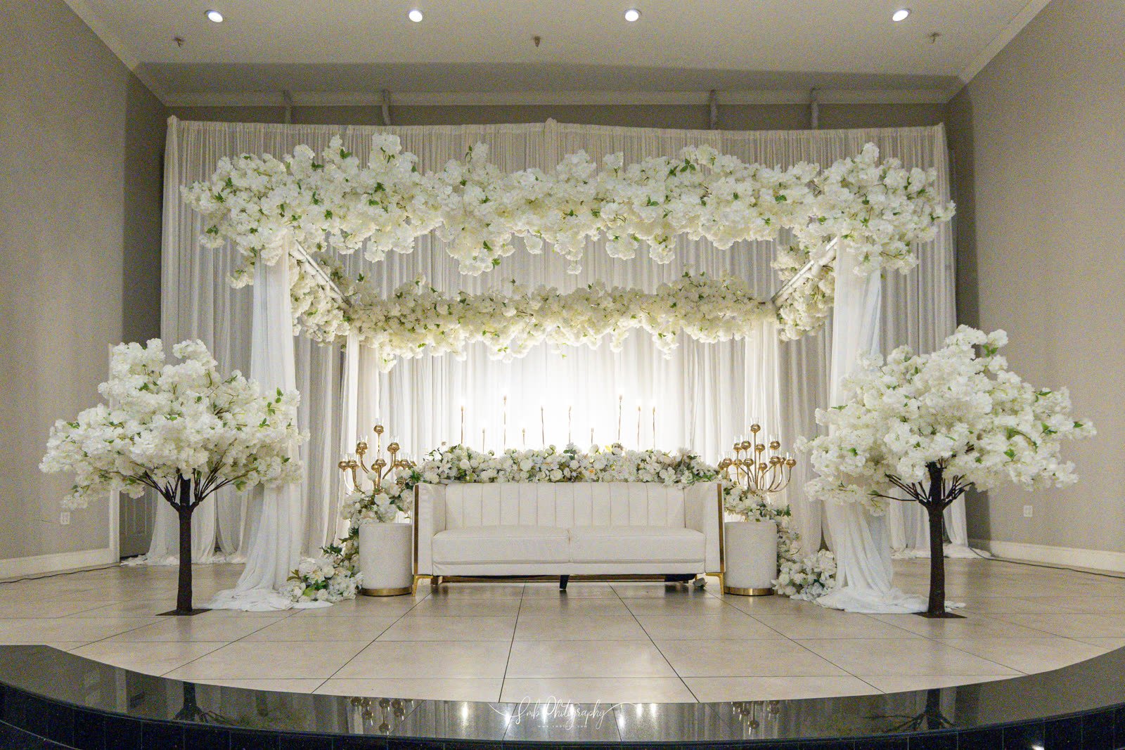 A blossom-framed stage and seating