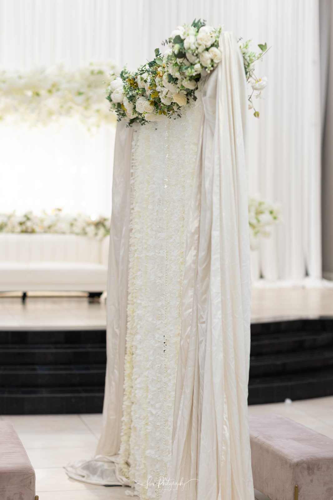 Sheer drapery and a low ceremony seat