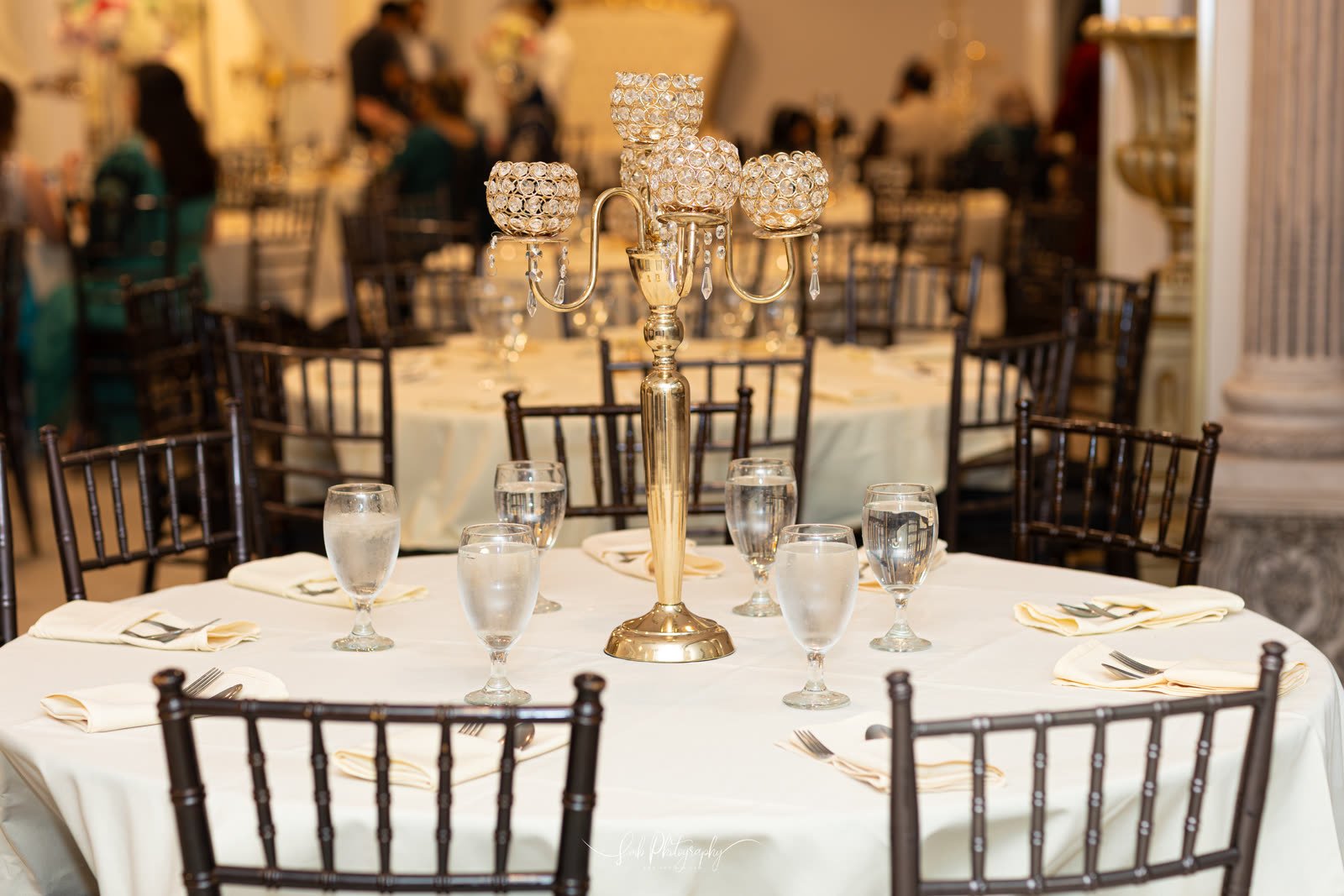 A candelabra centrepiece on a dressed round
