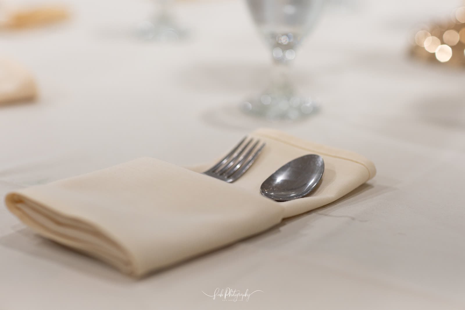 Folded linen and polished cutlery