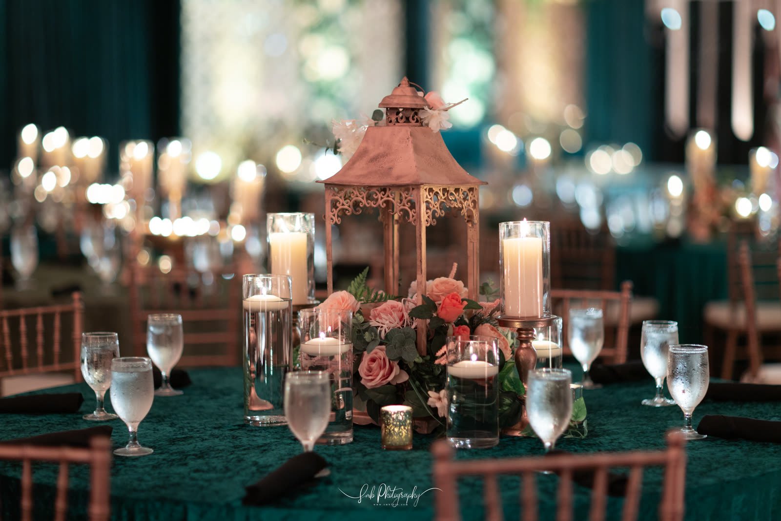 A floral and candle centrepiece in teal