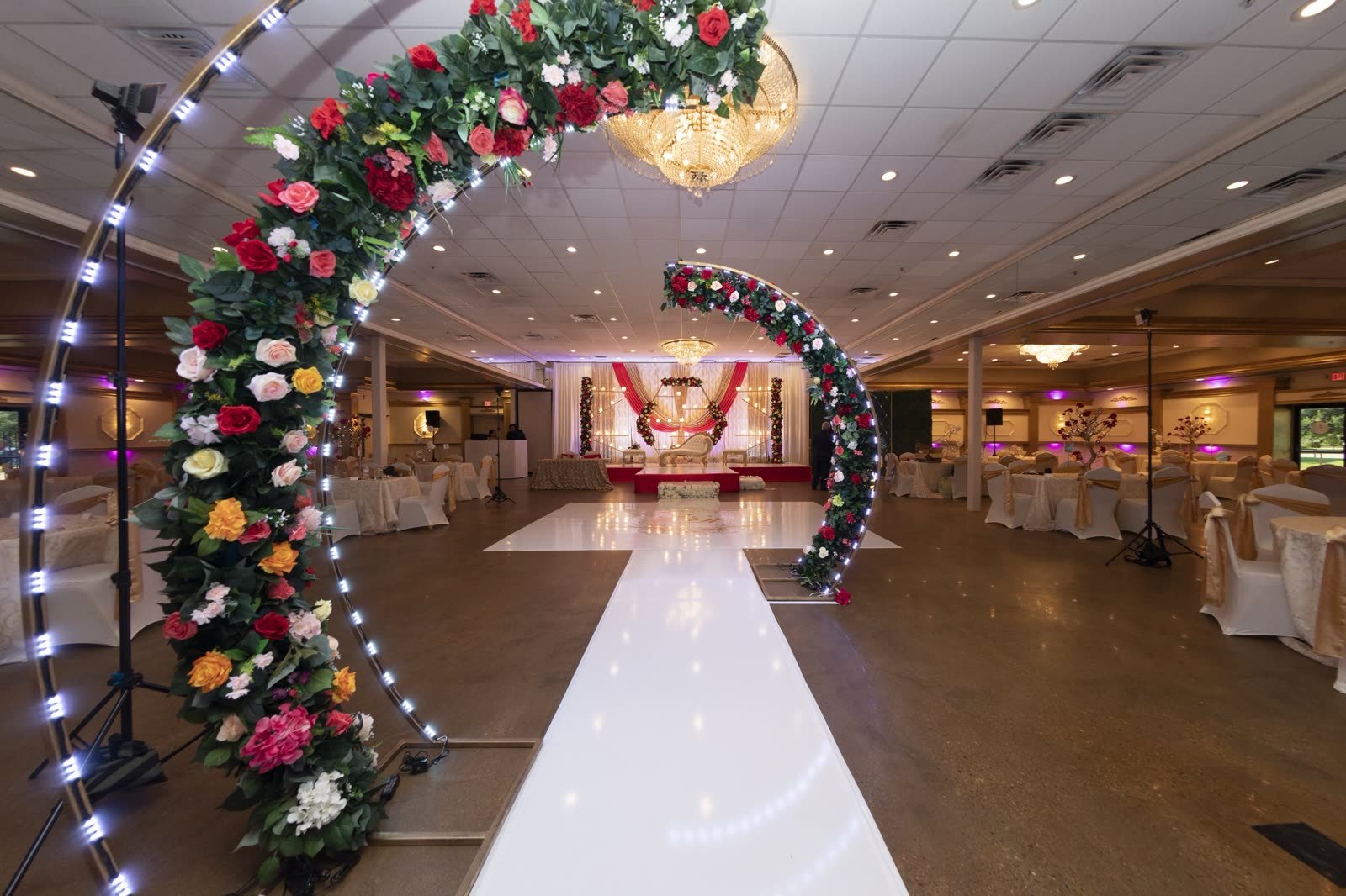 A floral arch over the walkway into the room